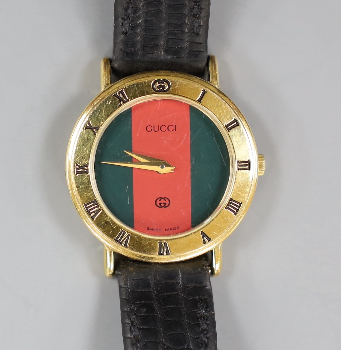 A lady's moder gold plated Gucci quartz wrist watch, no box or papers.
